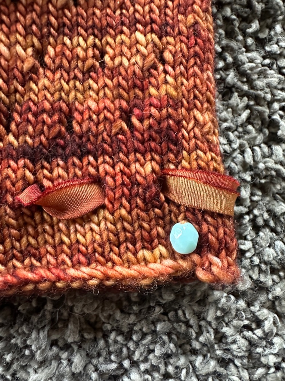 Hand-Knit Rust Orange Fingerless Gloves with Ribbon Detail - Picture 3 of 5